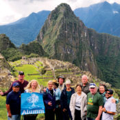 Clouds cleared for a group photograph of Machu Picchu, the Lost City of the Incas. Travelers marveled at the city’s dry-stone walls, an architectural feat nestled on high-altitude mountain peaks.