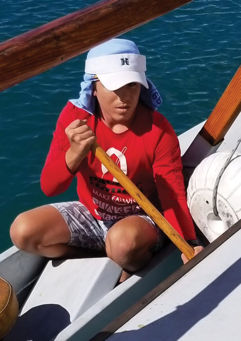 Kaimana Drago ’19 helps steer a Hawaiian sailing canoe during the Try Voyaging G-Term.