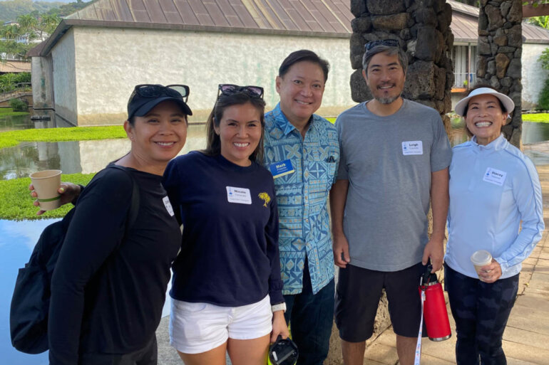 Five people from the PFA group standing in front of the Lily Pond.